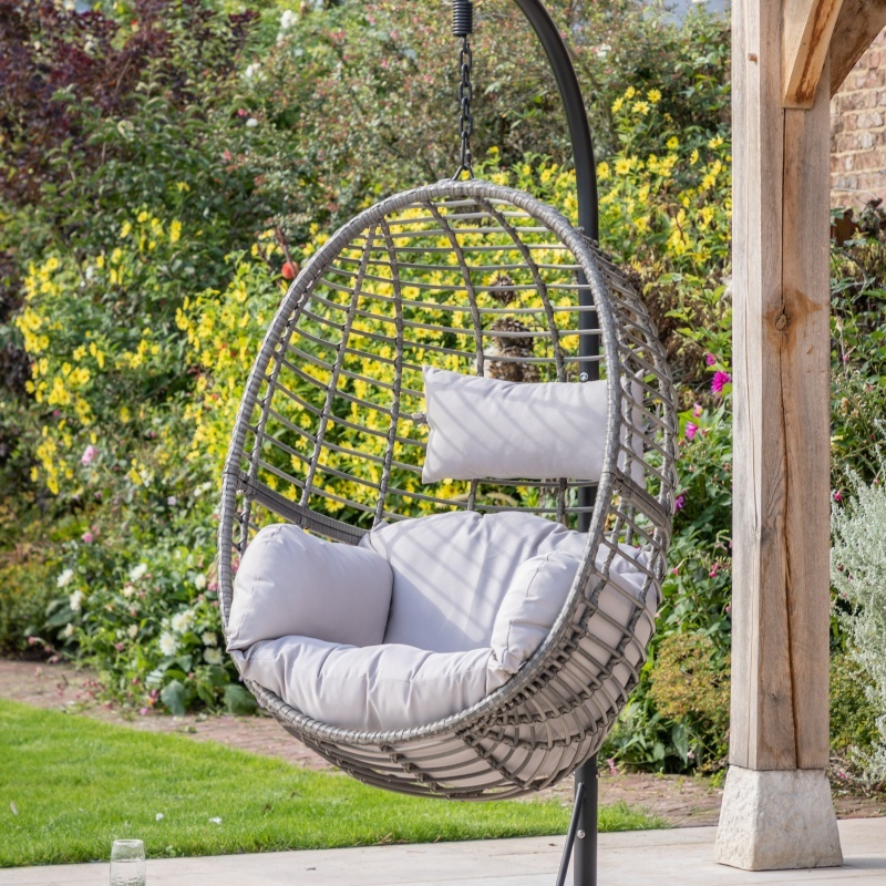 Adanero hanging chair with cushions in garden setting